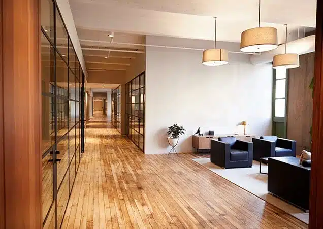 business-premises A modern commercial building with large glass windows and a sleek gray facade.