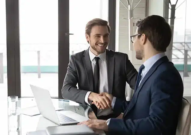 insurance-partner They are looking at a tablet and discussing something with smiles on their faces.