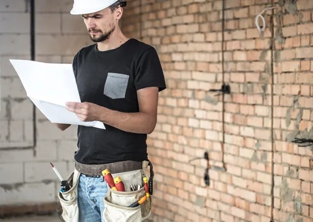 Construction workers on-site with safety gear, emphasizing protection for construction businesses.