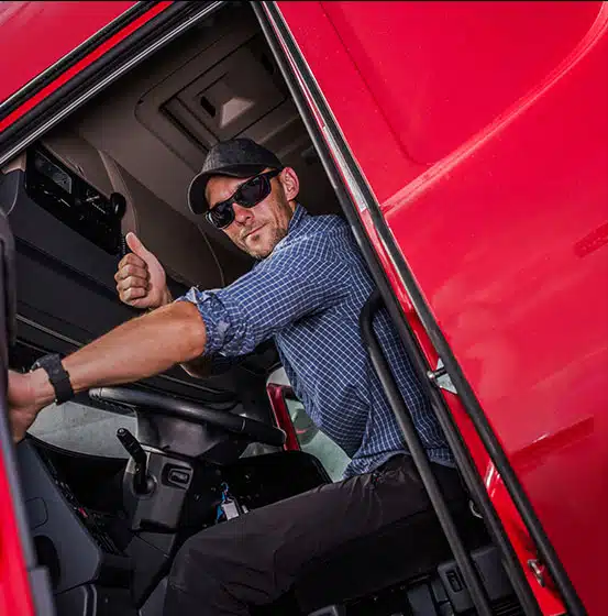 Smiling man giving a thumbs up, representing customer satisfaction with insurance services.